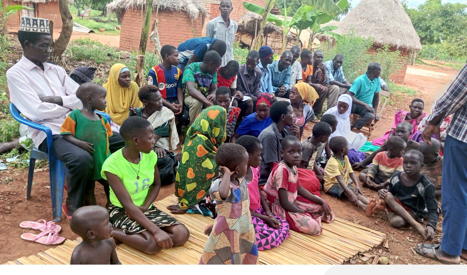 Large group of children and community members