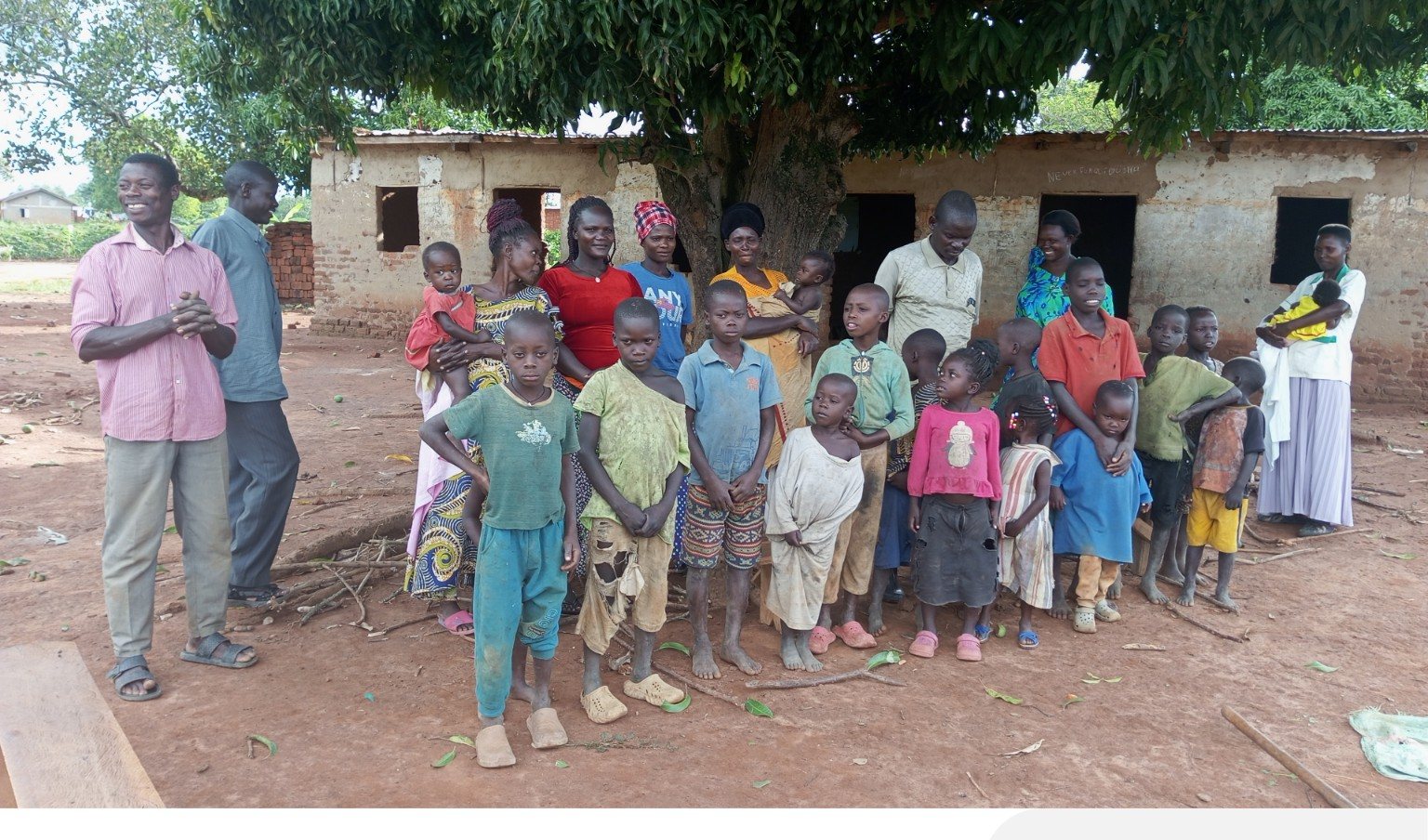 Community members and children outdoors
